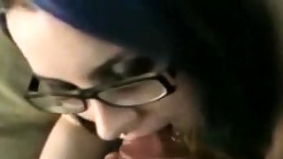 Sexy brunette with glasses providing blowjob in..